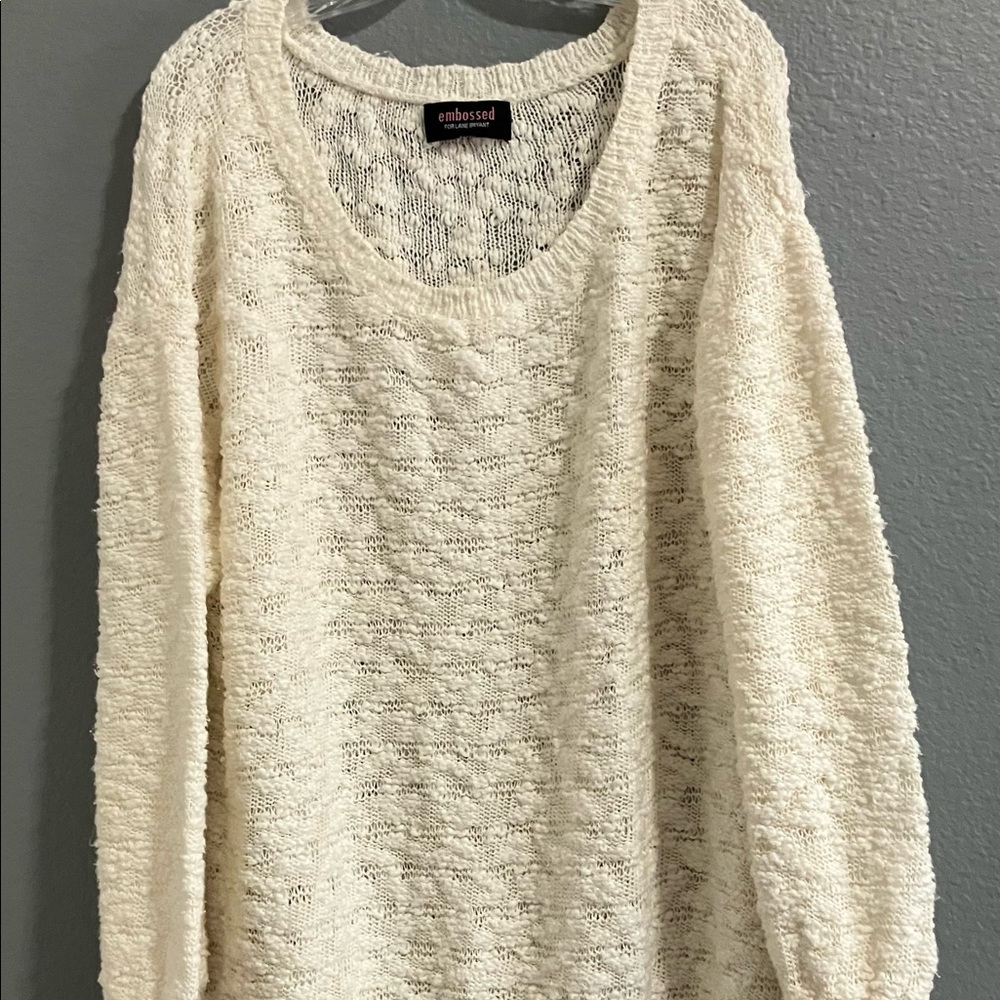 This beautiful cream knit sweater has only been worn twice.